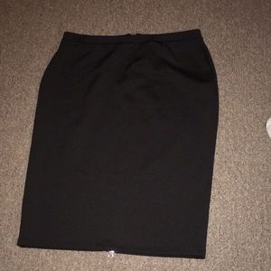 Black pencil skirt. 28 inches in length.